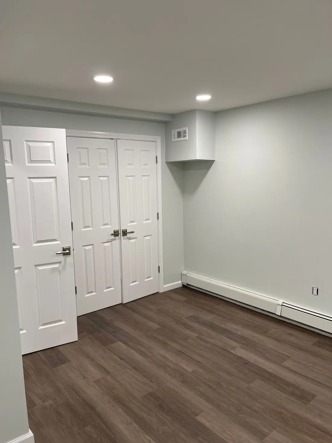Basement bedroom with double closet doors