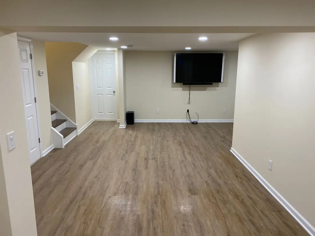 Finished family room with a TV wall