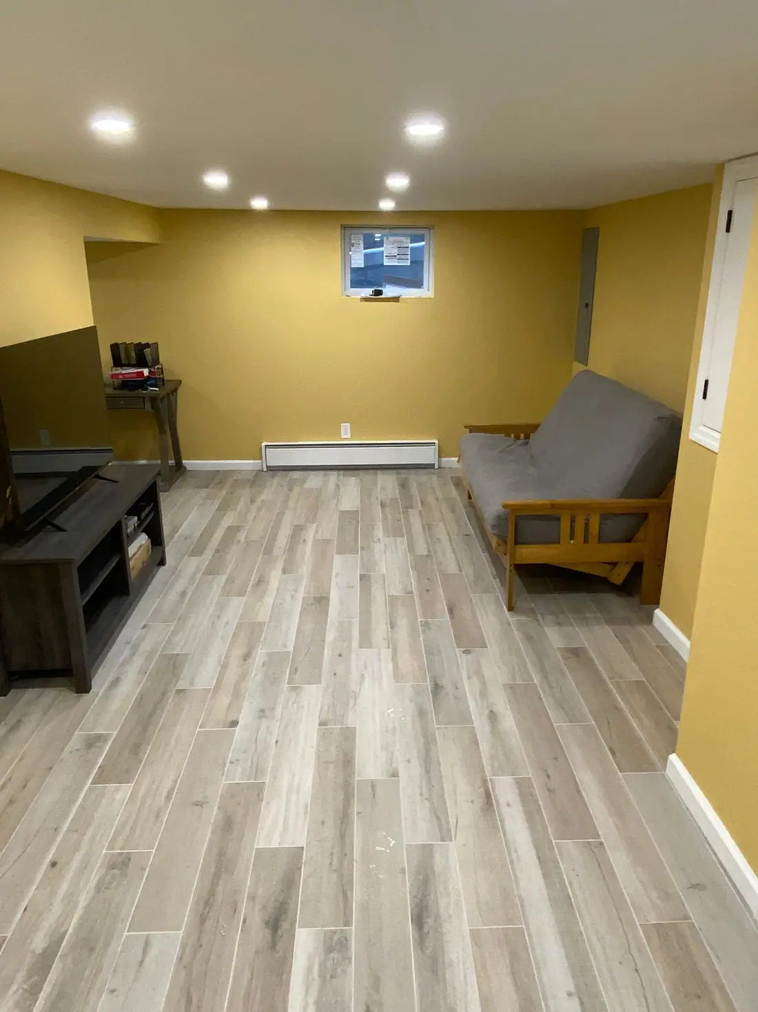 Basement family room with plank floors