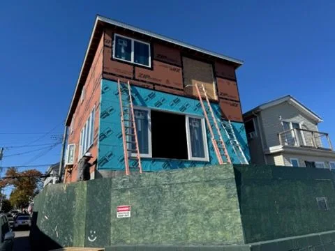 Sheathing on and new windows going in