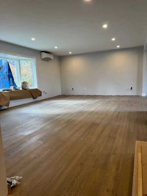 New oak floor through an open living room