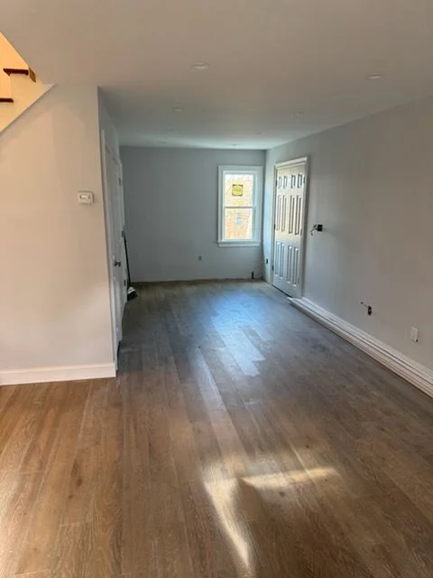 Oak floor running the length of a long hallway