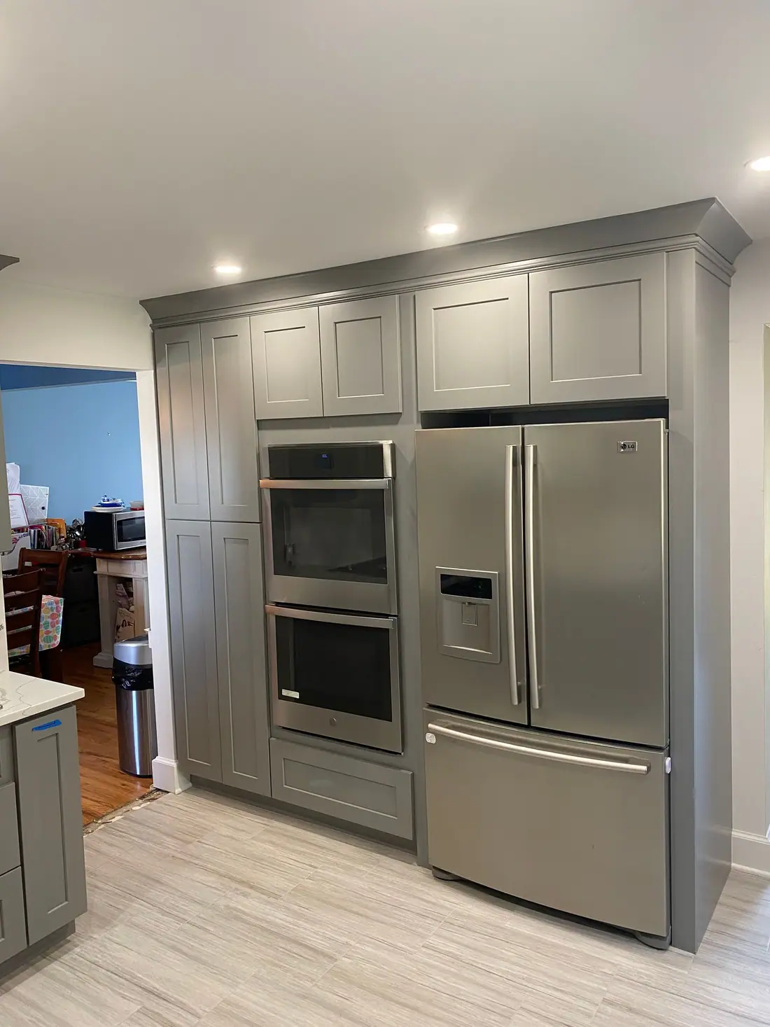 Gray shaker kitchen with double wall ovens