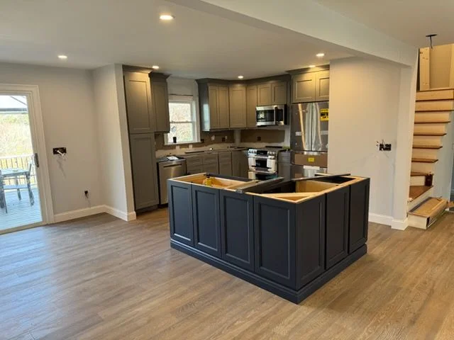 Navy island and gray shaker kitchen on a whole-floor remodel in Mahopac, NY