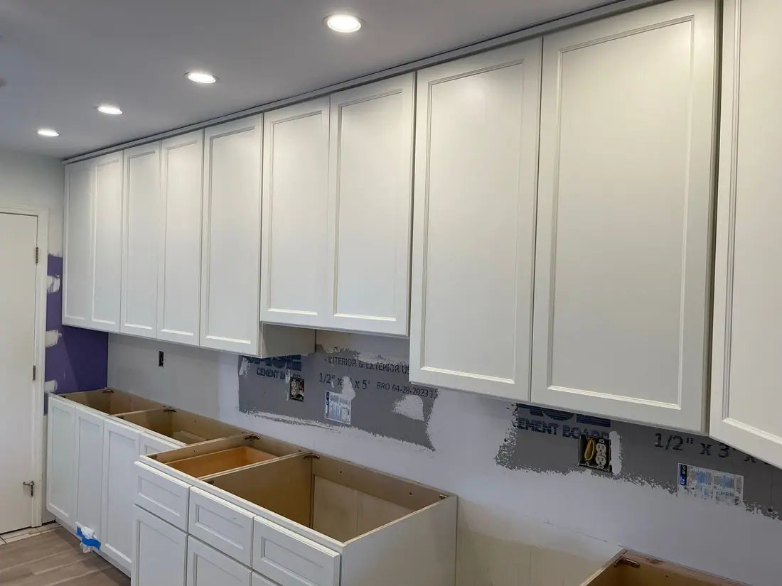 Upper cabinets installed and leveled on a Northeast Construction NY kitchen job