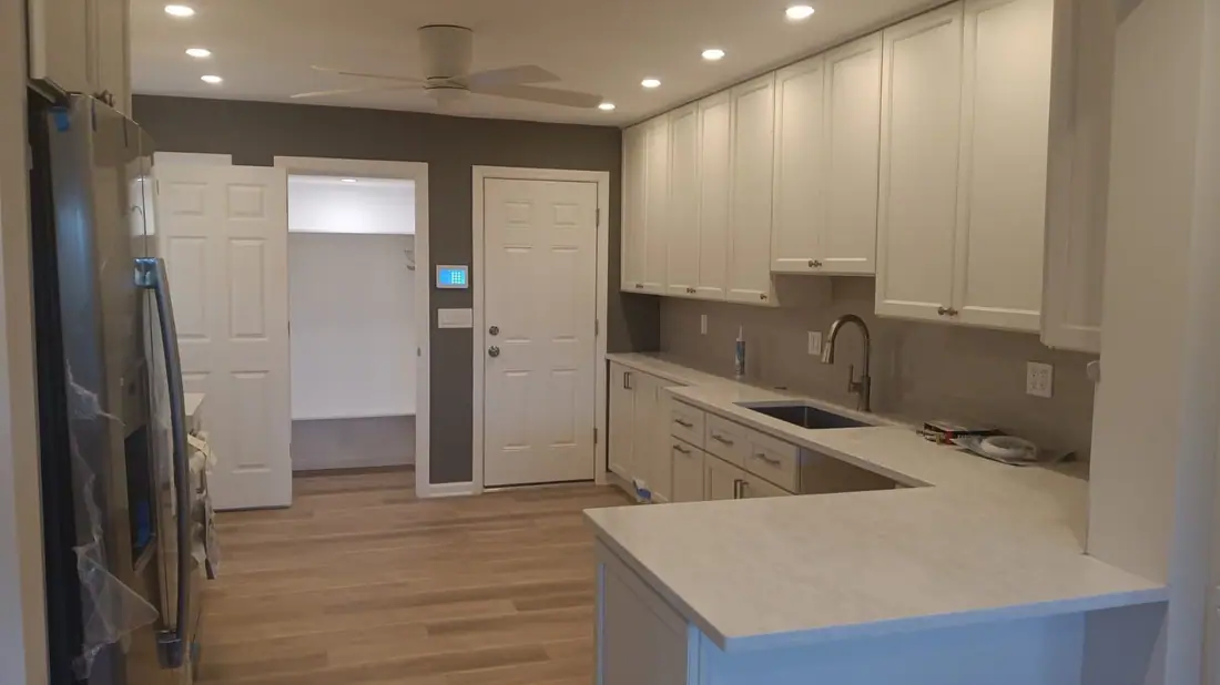 Open kitchen with a large island and plank floors
