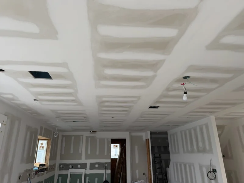 Taped ceiling in a big room by the water