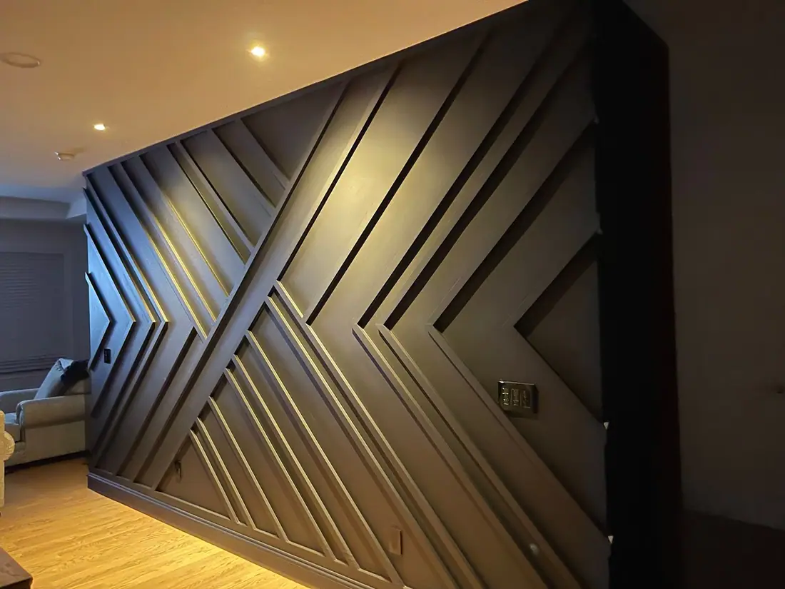 Matte black geometric accent wall built by Northeast Construction NY